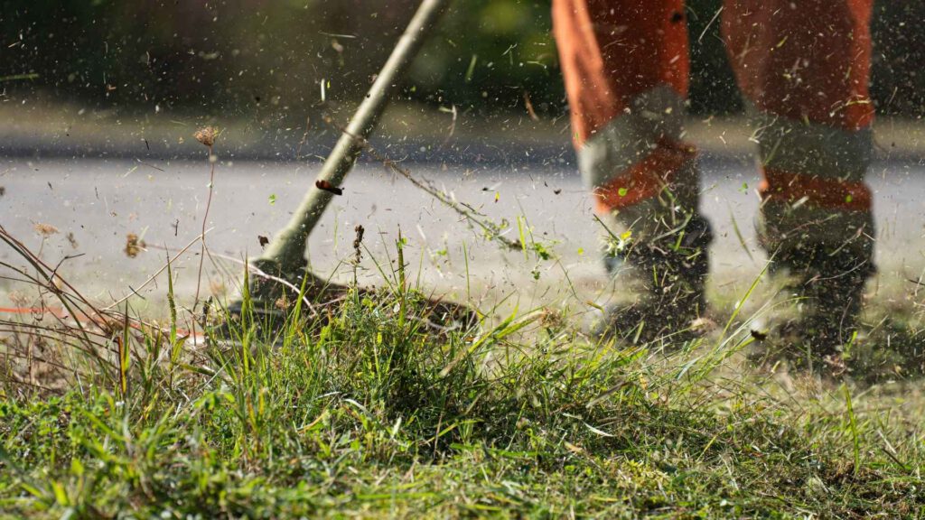 okc handyman mowing a lawn